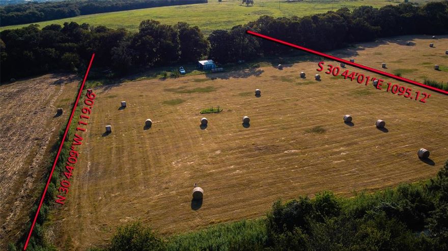 Escape to the peace and privacy of the countryside with this nearly 7-acre secluded property tucked away off a quiet, tree-lined country road. This picturesque tract offers the serene rural setting you’ve been searching for and an ideal location to build your dream home. The land features open, usable pasture with native grasses and established coastal Bermuda suitable for hay production, complemented by several mature trees that add beauty, shade, and character. Water is available at the street, and with no restrictions, you have the freedom to build and use the property to fit your vision. Enjoy wide-open spaces, fresh air, and endless possibilities in this tranquil country retreat.