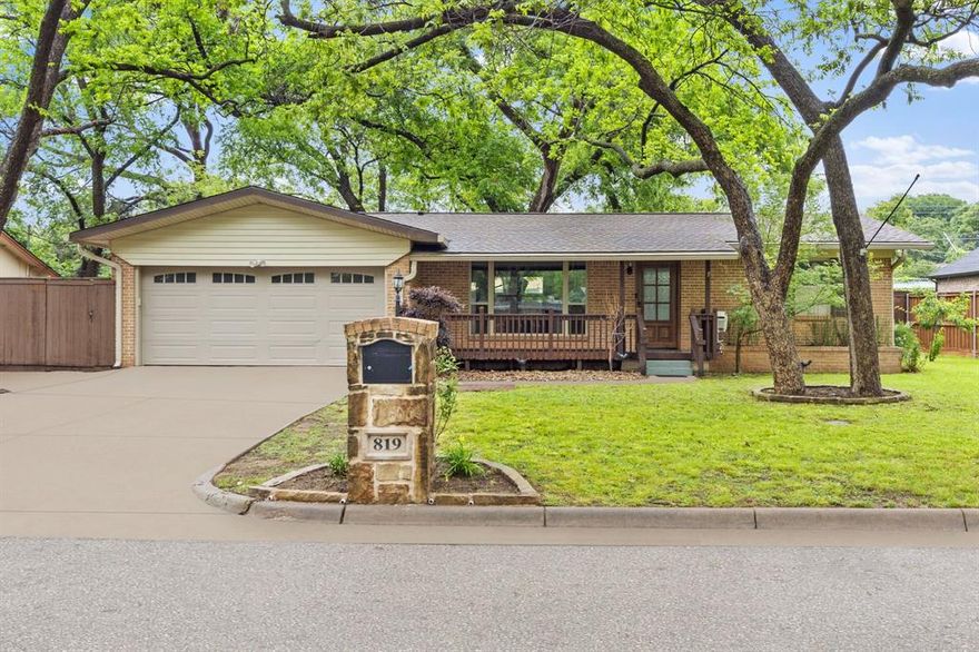 Opportunities like this are hard to find—nearly a quarter-acre in the heart of Arlington for around $300,000.

This charming 3-bedroom, 2-bath home offering 1,358 square feet sits on an oversized lot and immediately stands out with its inviting front porch and large front-facing window that fills the living space with beautiful natural light while offering peaceful views of the mature trees.

Inside, you’ll find an open and functional layout enhanced by crown molding throughout, updated light fixtures, and custom real wood cabinetry, along with a kitchen equipped with stainless steel appliances, creating a comfortable space for both everyday living and entertaining. A second large window overlooking the backyard continues to bring in natural light and showcases the true highlight of the property—the expansive outdoor space.

Step outside to a spacious backyard deck, perfect for relaxing, entertaining, or enjoying the privacy and nature that surrounds you. The yard itself offers rare space and flexibility, complete with a private water well, making it ideal for gardening, outdoor projects, or simply enjoying the freedom that comes with a lot of this size.

Additional features include a new water heater, a 2-car garage, and an oversized driveway with space to accommodate multiple vehicles, adding both convenience and flexibility.

Located just minutes from Arlington’s Entertainment District, you’ll have quick access to AT&T Stadium, Globe Life Field, restaurants, and major attractions, all while still enjoying the space and privacy this property provides. DFW Airport is also less than 30 minutes away.

If you’ve been looking for land, location, and value—this is one you don’t want to miss. Schedule your showing today.