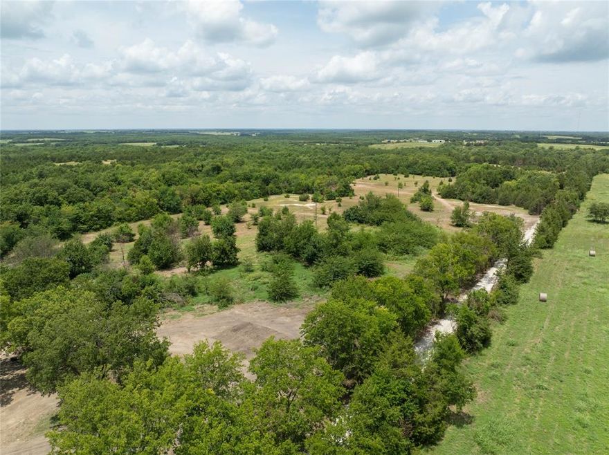 Tract #6 of 8 – Prime Country Living Near Bois d’Arc Lake – Build-Ready Lots Available! Owner Financing Available. Discover your slice of Texas paradise just 8 miles from the shores of Bois d’Arc Lake and 10 miles from the newly constructed Lake Ralph Hall. Use your current home equity to purchase this land. See agent for more info. Nestled south of Highway 82 with a Windom address, these serene parcels offer the perfect blend of nature, convenience, and opportunity. Property Highlights: - Peaceful Setting: Located at the end of a quiet, tree-lined county road with beautifully maintained surroundings - Natural Beauty: Each lot features mature native trees, walking trails, and scenic seasonal creeks; select tracts include private ponds - (Tract 6 has a pond) Ideal Topography: Flat, dry, and buildable land — ready for your dream home, cabin, or investment project - Easy Access: All parcels boast easy access on a newly built private road - Utilities Ready: Electricity is available on every lot - Water Access: water main by Bois D’Arc MUD is established - Water Update: Seller is actively funding the final line upgrade and extension to accommodate all new tracts. Whether you're seeking a peaceful retreat, a weekend getaway, or a smart land investment near Texas’s newest recreational lakes, these parcels check every box. Act now to secure your lot before prices rise with utility completion!.  Inquiries, call Listing Agent. Use for exact address:  725 County Road 2997 Windom, TX 75492