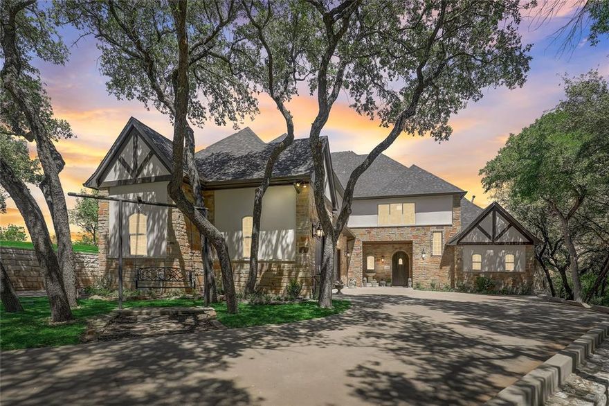 IINCREDIBLE VIEWS! OVER 150FT OF LAKE FRONTAGE! Nestled on the shores of Lake Granbury, this is the house for your discerning buyer looking for their home or weekend getaway. The open floor plan invites you into a space adorned with stone walls crafted from genuine Granbury stone. Klipsch Audio speakers throughout. Host a movie night in the theater or relax by the natural gas fireplace with remote. The gourmet kitchen features hand-built white oak cabinetry, Taj Majal granite countertops, Gaggenau built-in refrigerator freezer, Bertazzoni commercial range and Dacor microwave. The owner's suite features sliding antique hardwood doors leading to the spa-like master bath, complete with a custom-built oak cabinetry and a sitting area opening onto the pool deck. On the 3rd floor discover a spacious office suite with a balcony overlooking the lake. Outdoor living is amazing with a wireless motorized patio screen system and custom speaker system perfect for entertaining guests by the pool.