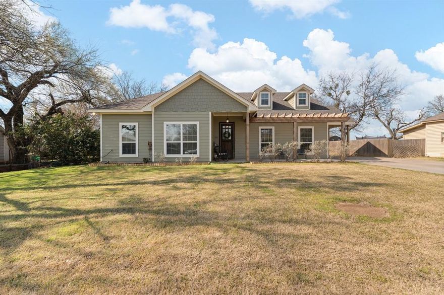 This home which offers an assumable loan interest rate of 3.3% sits just about nine miles east of Ham Creek Park, giving you easy access to the beautiful Brazos River — perfect for boating, fishing, and enjoying everything the outdoors has to offer. It’s also located in Rio Vista ISD, well known for its desirable four-day school week.
This one-owner, three-bedroom, two-bath home has been lovingly maintained and offers fantastic curb appeal, a large welcoming front porch, and plenty of parking space for your vehicles, boats, and more.
Inside, you’re greeted by a spacious family room with a cozy wood-burning fireplace that flows seamlessly into a generous eat-in kitchen — ideal for hosting gatherings or enjoying everyday meals at home.
The primary suite provides a relaxing retreat with a soaking tub, walk-in shower, and two walk-in closets. Thoughtful finishes throughout such as tall ceilings, tall doors, spray foam insulation, exterior jelly fish lighting and so much more make the home truly shine. You’ll also appreciate the dedicated laundry room with storage and a convenient mudroom.
Situated on a large lot, the backyard offers plenty of space to spread out, along with a 10X16 storage shed for all your extras.
This home has comfort, functionality, and location — all wrapped into one. Come see what makes it feel like home.