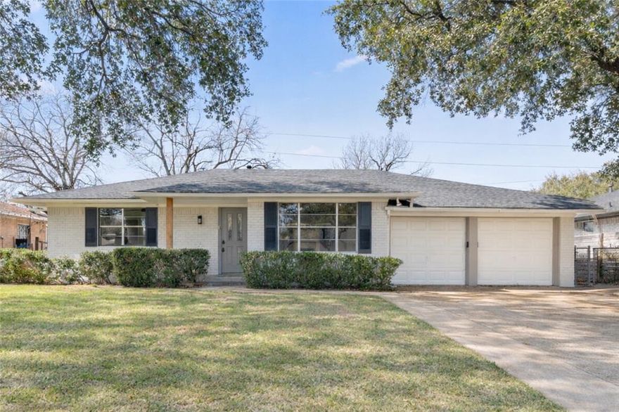Extensively renovated 2 bed, 2 bath Oak Cliff home located in the desirable Stevens Park, conveniently located blocks away from Bishop Arts, Stevens Park Golf Course and Trinity Groves. At 1554 square feet with a 2-car garage, this home has a functional and open floor plan on approximately .21 acres. With two living spaces, there is flexible space for everyday living and entertaining. The kitchen features shaker cabinetry, updated quartz countertops, modern tile back splash, and stainless steel appliances including a gas range and a dedicated breakfast - dining area. Built-in bookshelves and cabinets flank the beautiful stone fireplace in the adjacent living room and a sliding door opens to the rear patio and fenced backyard with mature trees and a storage shed. The primary bedroom features two closets with an ensuite bath that is updated with modern fixtures and hardware, large format tile, a frameless walk-in shower, and updated vanity. Additional updates include interior & exterior paint, AC unit, roof, plumbing, flooring, cabinetry, countertops, light fixtures and hardware. This home is move-in ready in an established neighborhood near everyday conveniences, including shopping & dining, an unbeatable location.
