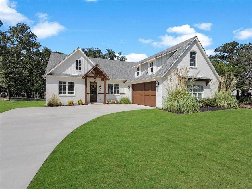 **THIS HOME IS NOT IN A FLOOD ZONE**  Welcome to your Parker County retreat! Nestled on a one-acre lot, this single-story gem brings together modern comfort and a relaxed country vibe. From the moment you walk in, soaring cathedral ceilings and rich acacia wood floors set the tone—warm, inviting, and made for both everyday living and memorable gatherings.

The heart of the home is wide open, flowing seamlessly from the living room—anchored by a striking fireplace—to the chef-inspired kitchen. With quartz countertops, tons of cabinetry, a roomy island, and electric cooktop, this kitchen is equal parts stylish and functional. The breakfast nook is a sweet bonus: sip your coffee while watching birds play just outside your window.

The split-bedroom layout ensures everyone has their own space. The primary suite feels like a private sanctuary, complete with spa-worthy bath featuring dual vanities, a stand-alone soaking tub, and an oversized walk-in shower. Two additional bedrooms plus a dedicated office offer flexibility for family, guests, or work-from-home days.

But wait until you step outside. Mature trees, stone pathways, and a fire pit create your own private escape. Whether it’s roasting marshmallows, bird watching, or strolling down toward the stream, this backyard was built for making memories.

Add in energy-smart foam insulation, beautiful wood floors, and custom touches throughout—you’ve found a home that blends quality, personality, and a whole lot of heart.
