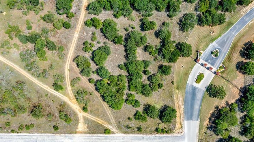 Ready to build 2.1-acre homesite in the gated community of North Star Pointe on Lake Bridgeport. Located just under 90 miles from the DFW Metroplex, this lot offers a great opportunity to build your weekend retreat or full-time home in a quiet, lakefront neighborhood. Residents enjoy access to community amenities including a pool, pickleball and tennis courts, a boat launch with day slips, and a clubhouse. Lake Bridgeport is known for its bass and crappie fishing and is also a favorite for boating and swimming.