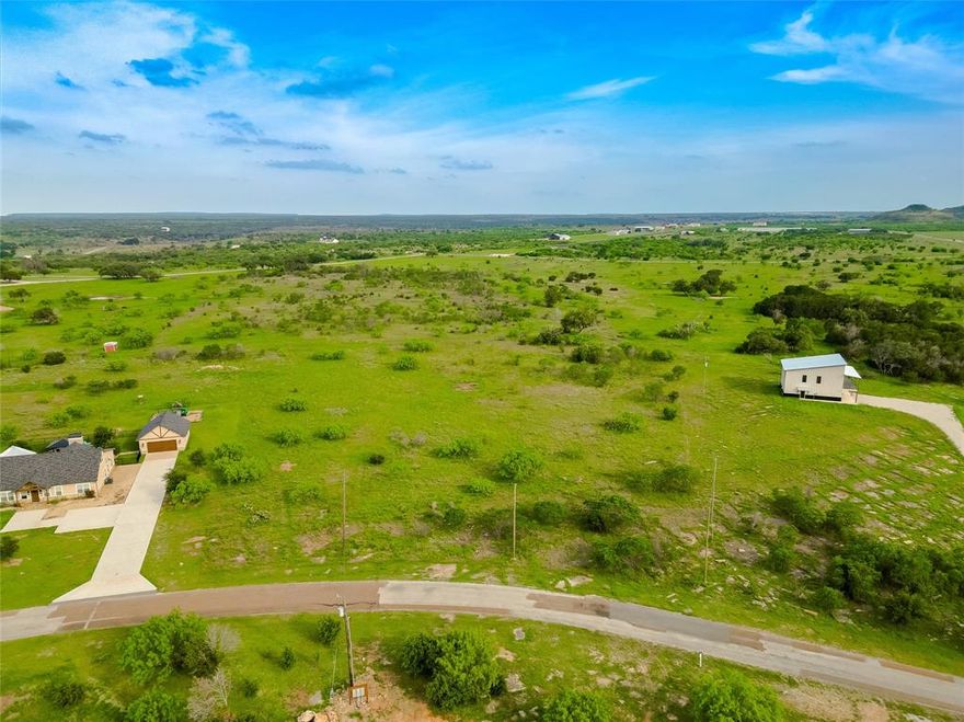Build your dream home, barndominium, or short-term rental (STR) investment on this 2.95-acre estate property in the desirable Sportsman’s World community at Possum Kingdom Lake! As an estate lot, this property allows for an additional dwelling, outbuildings, and even cattle or farm animals. Giving you the freedom to create a private retreat or an income-producing getaway. Located just around the corner from the full-service marina, you’ll enjoy easy access to boating, fishing, and all the lake adventures Possum Kingdom is known for. A convenient general store at the neighborhood entrance makes lake life effortless. Sportsman’s World offers community amenities including a marina, pool, playground, tennis courts, and a private airstrip. Whether you’re building a forever home, a weekend escape, or a rental investment, this property combines space, flexibility, and unbeatable lake access.