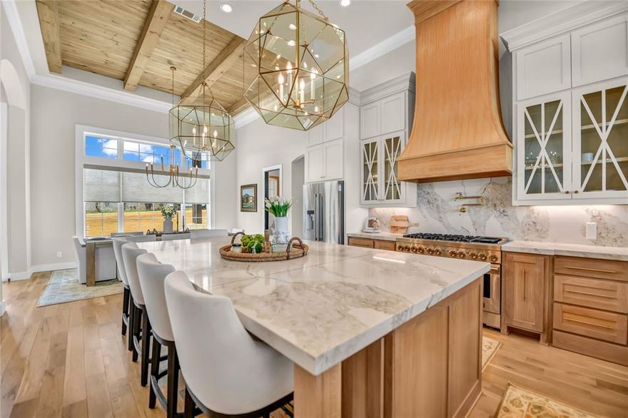 BEAUTIFUL HOME, POOL HOUSE, AND POOL!! 5889 sq feet of space! This stunning, CT custom home offers 4 bedroom and 5 and half baths with a thoughtfully designed layout that blends luxury, comfort, and functionality. Inside wood floors throughout, striking ceiling beams add warmth and character to the interior. The home features a dedicated office, and inviting media room, and a spacious game room, providing plenty of room to work, relax, and entertain. The kitchen is truly a gourmet kitchen with large working pantry, custom cabinetry, and dedicated wine room. Primary bedroom has a sitting area and a spa bathroom with a steam shower. Home is energy efficient with quality construction spray foam. heat pump and gas water heater. Step outside to your private patio retreat with an outdoor kitchen, fireplace, pool with spa, putting green, and magnificent views for miles. The outdoor living experience is completed by a 1125 sq feet pool house with a bar and serving window and a fire pit. Total of 5,889 of livable sq footage. Home is wired with a sound system throughout inside and outside the house. This home is top notch through and through.