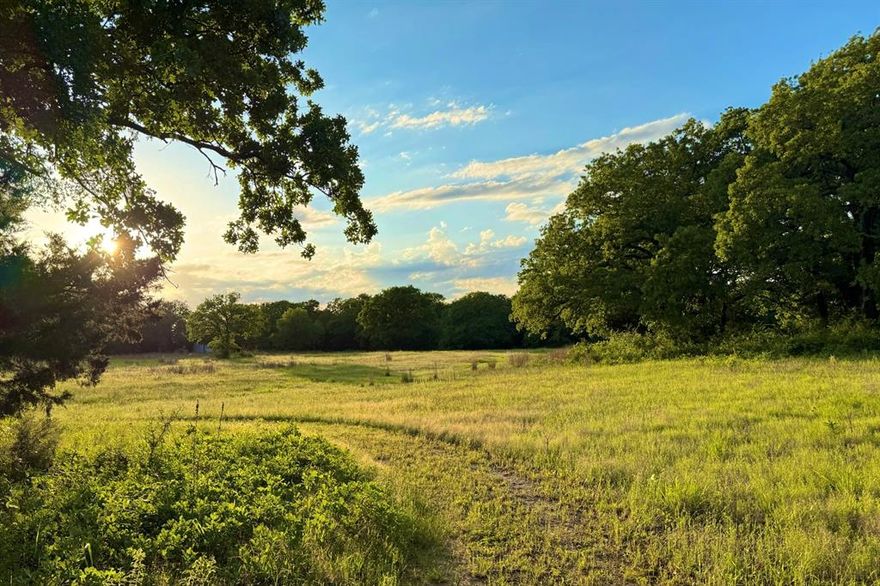 Welcome to your own private retreat located just 45 minutes north of downtown Dallas. Spanning 16.7 acres, this property offers breathtaking hilltop building sites, perfect for your custom dream home with scenic views of lush pastures and wooded areas. The property also has a custom-built barndominium featuring a versatile unfinished first floor that could be tailored for your needs with a spacious second-floor residence that boasts an open floor plan perfect for entertaining family or guests, including a vaulted living room, four comfortable bedroom suites, a large kitchen, dining area, and a master suite with office. A charming bunkhouse boasts a massive deck that feels like a tranquil tree house. The property is home to abundant native wildlife, and excellent fishing opportunities await at nearby Lake Ray Roberts. Explore the natural beauty of Isle du Bois State Park, which offers biking, hiking, and horseback riding trails. All this is just minutes away from the delightful historic downtown Pilot Point. Aubrey or Pilot Point ISD. To maintain the area's integrity, the property is lightly deed restricted. Wildlife exemption offering lower property taxes. See supplement documents for proposed restrictions.