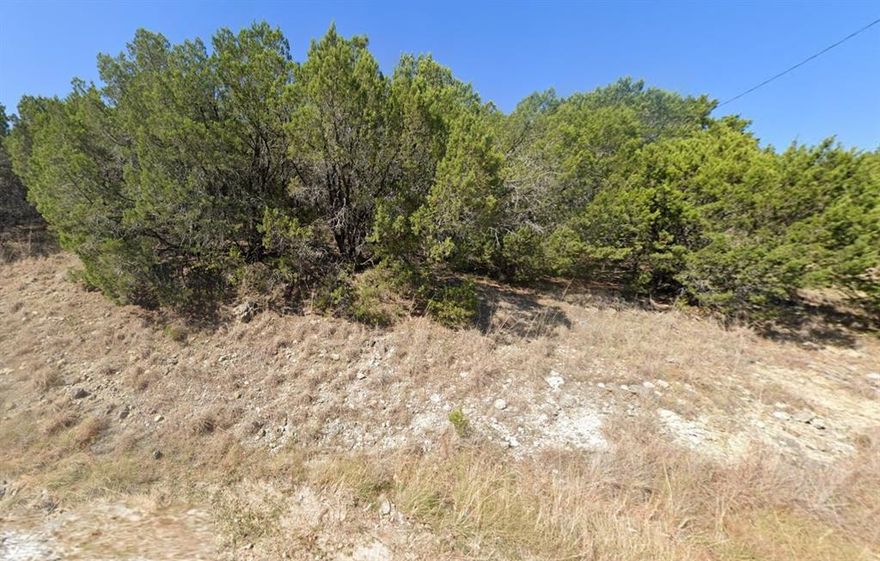 Lake view!! Build your dream home in the gated Canyon Creek community! This beautiful vacant lot offers so much potential! Build a 2 story home for gorgeous lake views. This property has water, electric, and sewer available at the street. Enjoy incredible neighborhood amenities including a guarded security gate, clubhouse, swimming pool, fishing pier, tennis courts, and multiple boat ramps. Conveniently located near Granbury shopping, dining, and lake entertainment, this is the perfect opportunity to create your ideal lake retreat!