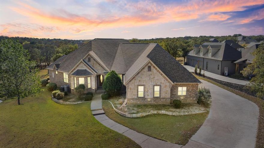 Welcome to 227 Sugar Tree Circle in Lipan — a beautifully appointed home tucked in the peaceful back section of the coveted Sugar Tree community. With no HOA, a treed lot, and direct golf-course frontage, this property offers the perfect blend of privacy, natural beauty, and everyday comfort.
Inside, you’ll find a spacious and inviting layout featuring four bedrooms and three full bathrooms, including two master suites — ideal for multigenerational living, guests, or added flexibility. The fourth bedroom is currently being used as an office but can easily function as a true bedroom, giving you options to fit your needs. The heart of the home is the grand kitchen, designed to impress with expansive counters, abundant cabinetry, and plenty of room to gather and cook. Multiple living and dining areas create comfortable spaces for entertaining or relaxing, and large windows frame peaceful views of the greens. The oversized garage offers exceptional space for vehicles, storage, tools, or even a golf cart. Step outside to a generous covered back patio overlooking the golf course — the perfect spot for morning coffee, evening unwinding, or simply soaking in the quiet surroundings. Located in Sugar Tree with no HOA, this home combines convenience, comfort, and the freedom to truly enjoy your space. TXT Lonestar2 to 88000 for a full video and instant info.