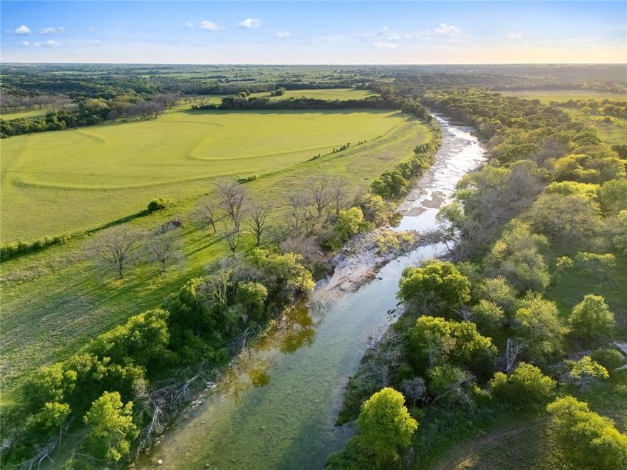 85 WATERFRONT ACRES  *Ranches at the River*  A rare opportunity to own one of the most desirable properties in Central Texas. This breathtaking tract offers over approximately 1,500 ft. of Middle Bosque River frontage, approximately 1,300 ft. of Pecan Creek frontage, almost  800 ft. of New Windsor paved road frontage. Featuring gorgeous rolling pastures, mature hardwoods, nearly 100 feet of elevation change and panoramic views that stretch for miles. With bluffs, fertile grazing pastures, and walk-in access to the Middle Bosque River, it's perfect for your dream home, working ranch or private retreat. The sellers have constructed a concrete bridge over Pecan Creek, providing full access to the entire property, all the way to the river. A beautiful mix of pasture, woods and waterfront making this land ideal for cattle, horses, ATVs, hunting, fishing, kayaking, camping. Nice woods for wildlife coverage and habitat...good amount of deer. Light restrictions protect the property's natural beauty and privacy, including no mobile or modular homes (barndominiums are welcome). Ag exemption in place, WATER METER and electricity available. Premier Central Texas location, convenient to Highway 6, Highway 84, Speegleville Road and FM 317 (Lone Star Parkway) and just 1520 minutes from Waco. Central Bosque Water, Heart of Texas Electric and McGregor ISD. Ag Exempt. McGregor and Crawford area.