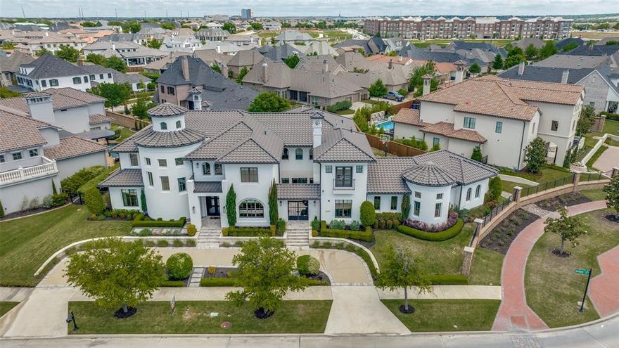 Exquisite custom Transitional Mediterranean Ron Davis home prominently located in highly desirable Newman Village. Soaring 20-foot ceilings and impeccable finishes. Residence emanates sophistication and refinement. Interior boasts a captivating rotunda entry, 5 BR, 5.2 Bath, 2 living areas, study, library, and gourmet kitchen replete with commercial-grade appliances, gas cooktop, coffee station. Opulent master suite features circular shower and expansive custom wardrobe. Guest BR on the first floor and 3 BR, game room, and media room upstairs, all with en-suite bathrooms. Outdoor oasis equally remarkable, showcasing pool, fireplace, fire pit, oversized outdoor kitchen. Residence outfitted with energy star appliances, Radio RA2 Lutron lighting controls, an Elon media system, mudroom, office nook, oversized utility and craft room. Expansive 3-car garage and electric gate contribute to convenience and security. Property offers the perfect blend of luxury, style, and functionality.