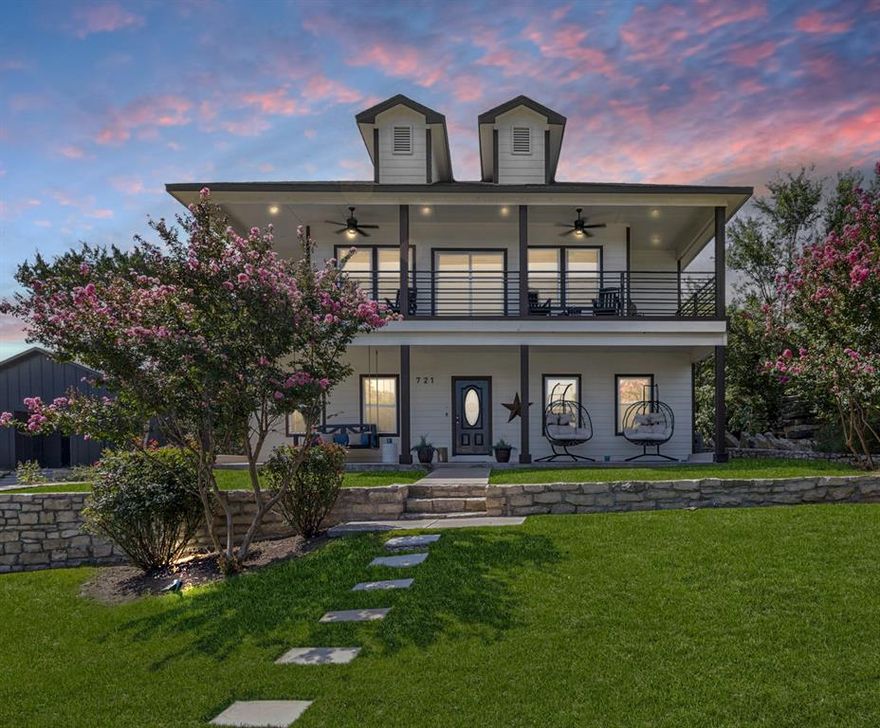 This is the Lake Granbury lifestyle you’ve been dreaming of, and it won’t last long! Imagine swinging on the daybed while basking in sunshine and taking in jaw-dropping, panoramic views. Step inside to a spectacular Hill Country retreat with soaring open-concept spaces, a chef-inspired kitchen with stainless steel appliances, gleaming white cabinetry, granite countertops, and a spacious dining area that flows seamlessly into a window-lined living room with endless lake views! The primary suite is pure luxury—a serene bedroom retreat overlooking the lake, connected to a spa-worthy 5-piece bath with soaking tub, dual granite vanities, and a custom walk-in closet! Upstairs, discover a second living area, open flex space, an oversized modern bathroom and two huge bedrooms, each offering more breathtaking views from inside or out on the wraparound balcony! Step outdoors and you’ll think you’ve arrived at a high-end resort—peaceful lounging spaces, elevated green space perfect for a pool and plenty of room for entertaining! Bring the boat or jet skis—your private neighborhood boat ramp & park is just 3 minutes away! Bonus perks: RV parking and endless options for lakeside fun! This modern lakeside escape is a rare find! Schedule your showing today before it’s gone!