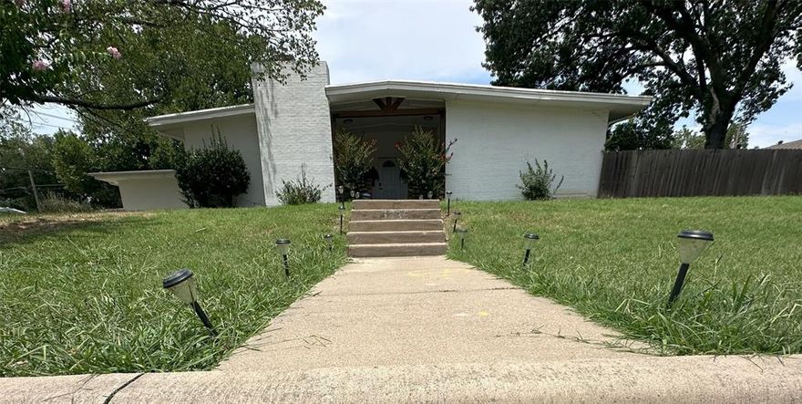 This beautifully updated mid-century ranch-style home is situated on a spacious corner lot in the desirable Wedgwood neighborhood. Offering 3 bedrooms, 2 full bathrooms, and 1,984 square feet of living space, the residence combines classic charm with modern amenities. The open-concept floor plan features two living areas, a formal dining room, and a kitchen equipped with stainless steel appliances and granite countertops. The primary suite includes an en-suite bathroom and a large walk-in closet. Additional highlights encompass a wood-burning fireplace, covered front and rear porches, and a private backyard with extra parking space.