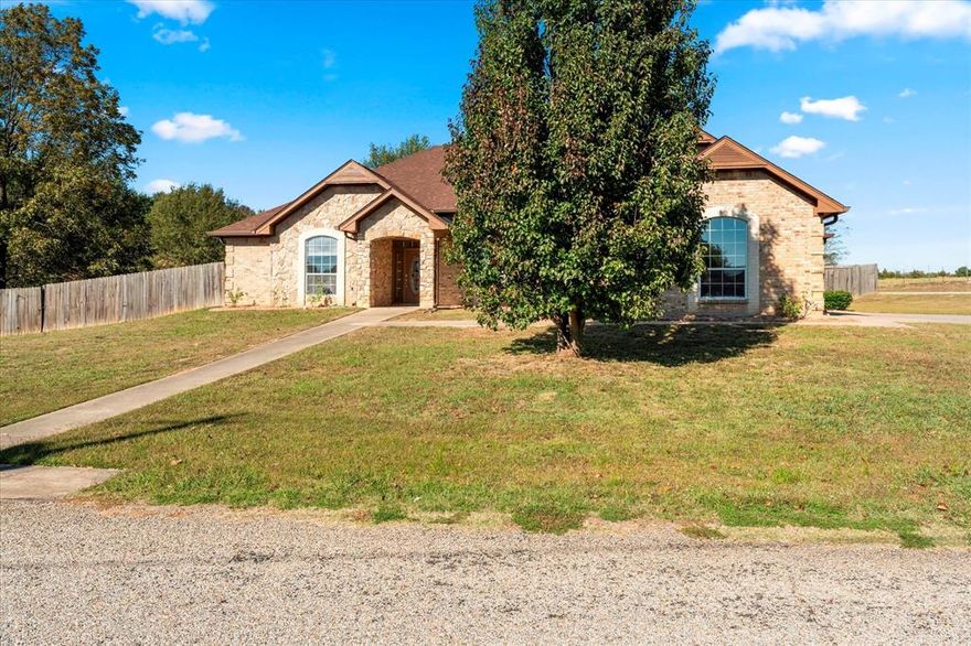 Trust our judgement! Bring your family to see this well kept 4 bedroom 2.5 bath home sitting on 0.55 acre corner lot. With just over 2400 SF of living space this property is move in ready. Walk into a home with a lot of living to do and lots of room for it. Living area showing off a cozy wood burning fireplace. The kitchen features stainless steel appliances, a breakfast bar, and adjoining dining area flooded with sunshine. The primary bedroom has an ensuite that features double sinks, shower &tub, and a walk-in closet. The covered patio sitting area adds the missing charming character ideal for entertaining. Why Read & Dream? Call for your appointment today!