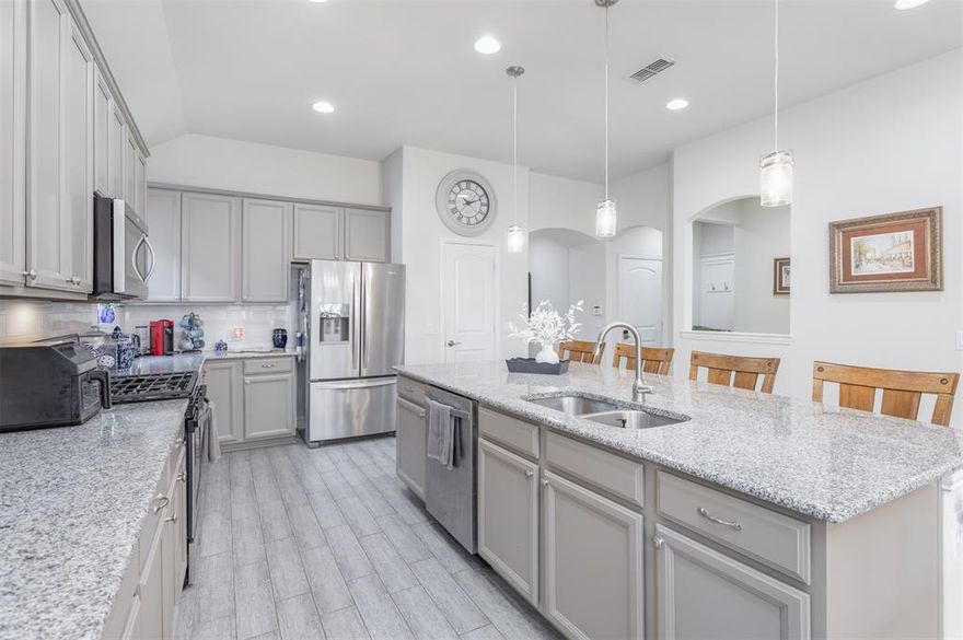 Welcome to your private retreat in Auburn Hills. This beautifully designed single-story home offers 3 bedrooms, 2 baths, and an effortless open-concept layout that lives both comfortably and elegantly. Natural light fills the spacious living area, seamlessly connecting to the kitchen and dining spaces — ideal for entertaining or simply enjoying everyday moments at home. The thoughtfully designed floor plan provides a private primary suite tucked away from the secondary bedrooms, creating a peaceful escape at the end of the day. Be sure to check out the his AND hers closets. Two additional bedrooms offer flexibility for guests, a home office, or play space. Step outside and discover the true showstopper — your own backyard oasis. The sparkling pool creates the perfect setting for summer gatherings, weekend relaxation, or quiet evenings under the Texas sky. Located in one of McKinney’s most desirable communities, Auburn Hills offers beautiful walking trails, parks, and resort-style amenities — all just minutes from shopping, dining, and everything you love about McKinney living. Single-story. Open living. Private pool. This one checks all the boxes.