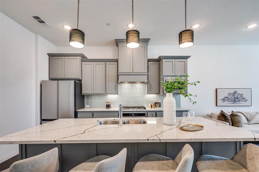 Wake up to soft morning sun, peaceful courtyard views, and a lifestyle designed around nature and walkability. Located on the island in Viridian, 3718 Pelican Rest offers a rare sense of calm just steps from the lake, trails, and preserved green space.

This three-level townhome features a flexible and functional layout. The first floor includes a private bedroom with en-suite bath and walk-in closet—ideal for guests, a home office, or multigenerational living—set against tranquil garden views.

The second floor is filled with natural morning light and offers an open-concept kitchen, dining, and living space that flows effortlessly for everyday living and entertaining. A convenient half bath is also located on this level.

Upstairs, the primary suite overlooks the beautifully maintained courtyard, creating a quiet retreat at the end of the day. A secondary bedroom with its own en-suite bath completes the third level, offering comfort and privacy throughout the home.

Just a two-minute walk from the front door, enjoy lakeside seating, scenic trails, and the natural surroundings that make Viridian one of North Texas’ most distinctive communities. Designed with conservation in mind, Viridian blends wetlands, lakes, and open green space with resort-style amenities including pools (with an adult-only option), tennis and pickleball courts, a sailing center, parks, and year-round community events.

Ideally located minutes from DFW Airport and positioned between Dallas and Fort Worth, this home offers the perfect balance of peaceful living and everyday convenience. Thoughtfully situated, light-filled, and surrounded by nature—3718 Pelican Rest is island living at its best.