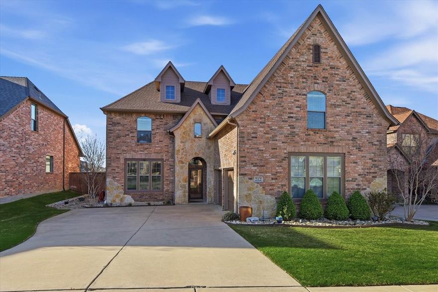 Welcome to this gorgeous 4-bedroom, 3.5-bath home designed for both everyday living and unforgettable entertaining. The open floor plan offers a seamless flow, highlighted by a warm and inviting living area with a cozy fireplace—perfect for gathering with family and friends.  The spacious kitchen is a chef’s dream, featuring abundant storage, granite countertops, a large breakfast bar, and a convenient butler’s pantry that leads into the formal dining room—ideal for hosting special occasions.  The private primary suite is located downstairs and offers a true retreat, with a beautifully updated ensuite bath featuring a jetted tub, separate shower, dual vanities, and a generous walk-in closet. The utility room adds extra functionality with a sink and space for a freezer.  Upstairs, you’ll find three spacious bedrooms, two full baths, and a versatile game room or second living area—perfect for movie nights, play space, or family gatherings.   Step outside to your own backyard oasis featuring a stunning 15 x 30 covered patio with an outdoor kitchen, infrared heaters, and a TV—creating the ultimate space for year-round entertaining.  This home truly has it all—space, style, and incredible indoor and outdoor living!  Don’t miss your chance to own this entertainer’s dream—schedule your showing today before it’s gone!  Home was freshly painted outside last week!