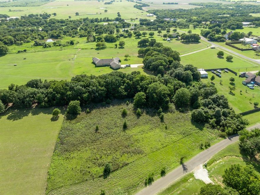 Desirable building acreage that rarely becomes available in this area of Whitney!  This property offers a pleasing mix of clearing and trees to create your perfect place to call home.  Grab your fishing pole and take a short stroll down to the fishing pond with shared access for all Overlook subdivision residents! NO HOA! Aesthetically pleasing to the eye with peaceful nature setting and beautiful site built homes in the area. Feel right at home and bring a family member as 2 Residential homes are allowed per lot at 1400 sqft minimum requirement.  Only a 10 minute drive to Lake Whitney, one the best recreational lakes close to DFW.  Easy restrictions and BRING YOUR HORSES!