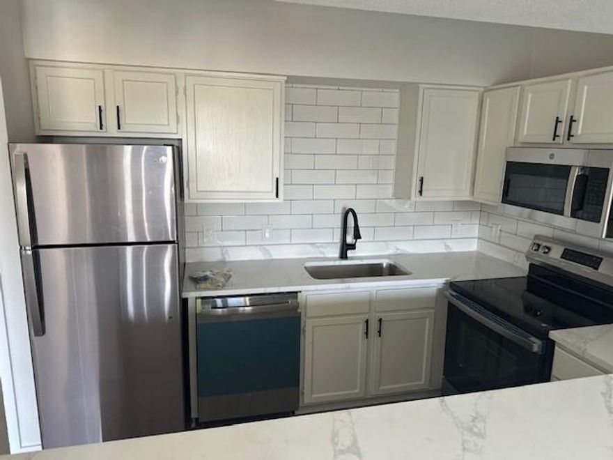 Like-New Unit!  Everything is new.  New cabinets, new stone countertops, new flooring, new appliances, new tub & shower, new sinks, new paint, new ceiling fans.

Unit has full size washer & dryer hookups.

Unit can be combined with the adjacent #126, which is a 2-1 new remodeled unit.