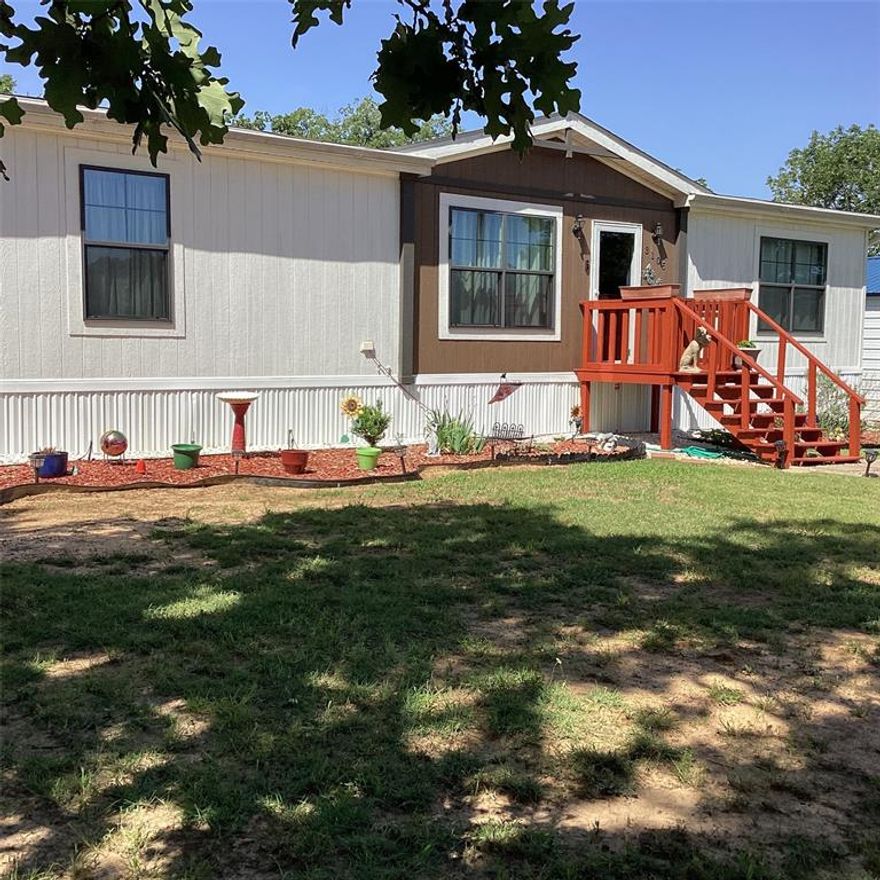 LIVING + Income makes a great life-style. PLUS NO CITY TAXES.  Step into this beautiful home that is very well maintained. It doesn't look like its been lived in, its so clean.  Split bedrooms, large kitchen island that accommodates the best chef. If its laundry day, it doesn't lack the space plus a large pantry area. Step outside to the oasis within your own private enclosed backyard. Covered deck area along with a covered Gazebo area. Storage building for any yard tools  is right at your footstep.  After a hard sweaty day, jump into the pool for relaxation and enjoyment.  Seller has built a new metal two car garage with concrete flooring and garage door opener.  Its huge inside, so there's room for other toys too!! Then, collect your monthly rent of $900 from your rental property. Wood framed home, 2 bedroom, 1.5 baths plus a small office area and a one car attached garage.  Kitchen has had major updating with cabinets and countertops. Separate laundry area.  Tenant is currently on a month to month.  Properties are on separate utilities, electric, water and septic. Main house is aerobic, rental is conventional. Seller will need 30-45 day lease back. 
Small metal lean too storage at back of property.  Seller does not have a survey which buyer will need to obtain.  Seller is leaving refrigerator that is in the mobile home kitchen.  Driveway is shared between the two homes.  Each property has separate Property ID's and addresses. Mobile home will be attached to the land at closing.