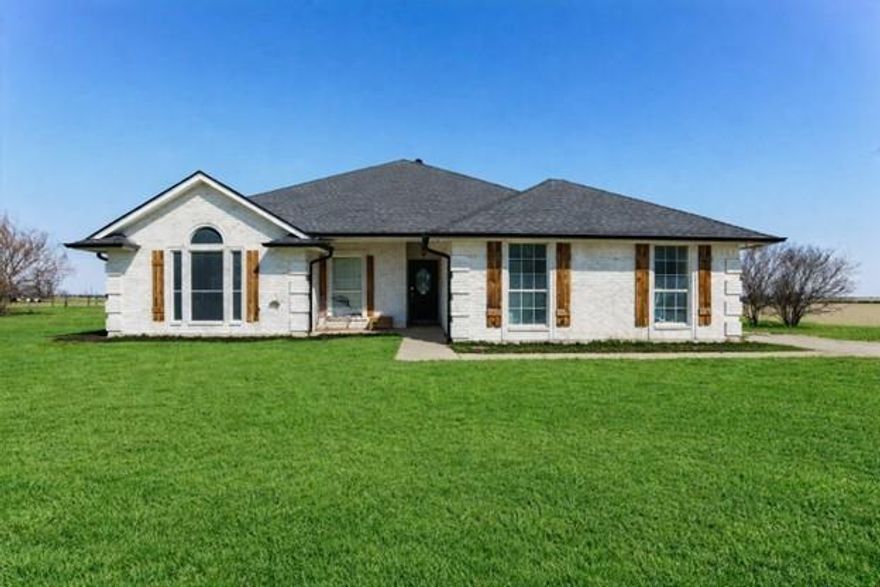 Welcome to Your Own Slice of Paradise! Don't miss this stunning 4-bedroom, 3-bath home nestled on 5 beautiful acres. Built in 1998 and thoughtfully remodeled in 2013, this 2,264 SF home offers the perfect blend of comfort, functionality, and space to entertain. Step inside to find a large, open-concept living area with a desirable split-bedroom layout. The kitchen is both cozy and practical, featuring granite countertops and stainless steel appliances that make everyday living and hosting a breeze. The HUGE primary suite is privately situated on its own side of the home, the en-suite bath has a walk-in shower, soaking tub, dual granite vanities, and his-and-hers walk-in closets. Bedroom 2 offers its own private corner with a walk-in closet and attached bath—perfect for guests or multi-generational living. Bedrooms 3 and 4 are conveniently located off the main hallway, both featuring walk-in closets and easy access to the hall bathroom. Multiple storage closets throughout the home make organization effortless. The attached 2-car garage includes a 6’x6’x78” corner storm shelter, offering added peace of mind during storm season. Plus, the HVAC system was replaced in December 2024—one less thing to worry about! Step outside and experience true backyard paradise. The spacious back porch, complete with a wall-mounted TV, is ideal for relaxing while the kids splash the day away in the 40’ x 20’ inground pool. Featuring a tanning ledge, slide, and diving board, this pool is built for unforgettable memories. Need space for hobbies or work? The impressive 2,000 SF metal shop includes a 20’ porch with walkthrough access and insulated roll-up doors on both the north and south sides—perfect for projects, storage, or recreational equipment. The on-site batting cage with turf is a dream setup for any baseball or softball enthusiast. To top it all off, the property features a stock tank on the north end that has never gone dry.