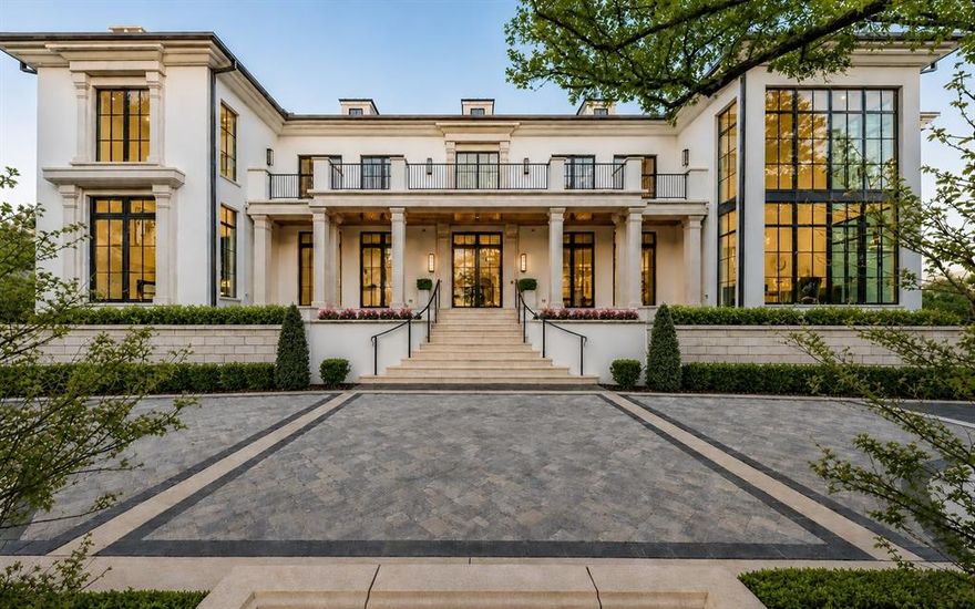NOW COMPLETE, brand new construction on Dallas’s most iconic street, known as Billionaire’s Row. Poised on 2.2 expansive acres along Bachman Creek, 10010 Strait Lane blends craftsmanship, elegance, & luxury. Interiors ft soaring ceilings, clean lines, & floor-to-ceiling Kolbe windows. Designed for comfort & entertaining, chefs kitchen boasts 2 La Cornue dual-fuel ranges (10-burners total), Subzero, Wolf, & Miele appliances, & Thomas OBrien chandeliers. Catering kitchen includes elevator access to support events with ease. Sunroom & Formal Living space soar w 24 ceilings, glass walls, & Vida chandelier. Owners wing ft vaulted ceilings, fireplace, indoor outdoor sitting areas, Julie Neill chandelier, spa bath w Bain Ultra tub, dual water closets, beverage bar, towel warmer, Nobu Ribbon tile (Spain), Kalta Fiore marble, Kelly Wearstler & Arteriors lighting. 2 walk-in closets, Hers w island, hidden shoe, handbag, & jewelry closets; His w safe & luggage storage. Other amenities include elevator, wellness retreat for massage & fitness, opt 1,600-bottle glass wine room & or lower-level wine vault, golf sim rm, craft & music rm, 3-tier theater, & study w fireplace. Entry ft 25 ceilings, 23-light John Richard chandelier & oak herringbone floors. 3 utility rms (1 per floor), mudroom w dog shower. Outside ft screened loggia w fp & heaters, outdoor kitchen w pass-through window to main kitchen, negative-edge pool, spa, sun deck, & opt fire pit create a resort retreat. 4,181 sf air conditioned 10-car garage that doubles as an event venue. 8 terraces include cigar balcony, primary terraces, upstairs suites, front colonnade, & back loggia. Landscape lighting, optional tennis or sport court. Surrounded by mature trees & creek, offering privacy in prestigious Preston Hollow neighborhood. Built with concrete walls & steel supports, ensuring bunker-like strength, 10010 Strait Lane offers a once-in-a-lifetime opportunity in the heart of the private school corridor.