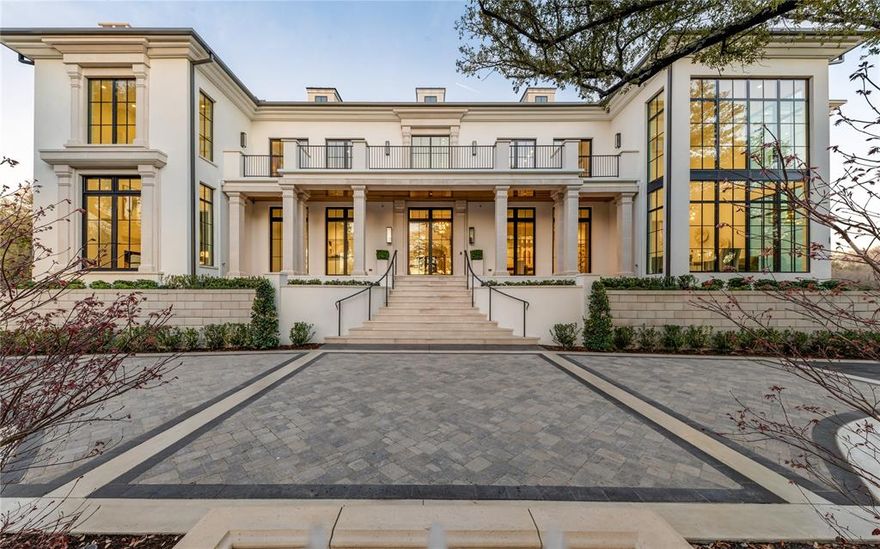 Poised on 2.2 expansive acres along Bachman Creek, 10010 Strait Lane is a California Transitional estate of 16,600+ sf blending craftsmanship, elegance, & luxury. Interiors ft soaring ceilings, clean lines, & floor-to-ceiling Kolbe windows. Designed for comfort & entertaining, chef’s kitchen boasts 2 La Cornue dual-fuel ranges (10-burners total), Subzero, Wolf, & Miele appliances, & Thomas O’Brien chandeliers. Catering kitchen includes elevator access to support events with ease. Sunroom & Formal Living space soar w 24’ ceilings, glass walls, & Vida chandelier. Owner’s wing ft vaulted ceilings, fireplace, indoor outdoor sitting areas, Julie Neill chandelier, spa bath w Bain Ultra tub, dual water closets, beverage bar, towel warmer, Romani Travertine (Italy), Nobu Ribbon tile (Spain), Kalta Fiore marble, Kelly Wearstler, Arteriors lighting. 2 walk-in closets “Hers” w island, hidden shoe, handbag, & jewelry closets; “His” w safe & luggage storage. Other amenities include elevator, wellness retreat for massage & fitness, opt 1,600-bottle glass wine room &or lower-level wine vault, golf sim rm, craft & music rm, 3-tier theater, & study w fireplace. Entry ft 25’ ceilings, 23-light John Richard chandelier & oak herringbone floors. 3 utility rms (1 per floor), mudroom w dog shower. Outside ft screened loggia w fp & heaters, outdoor kitchen w pass-through window to main kitchen, negative-edge pool, spa, sun deck, & opt fire pit create a resort retreat. 4,181 sf air conditioned 10-car garage that doubles as an event venue. 8 terraces include cigar balcony, primary terraces, upstairs suites, front colonnade, & back loggia. Landscape lighting, optional tennis or sport court. Surrounded by mature trees & creek, offering privacy in prestigious Preston Hollow neighborhood. Built with concrete walls & steel supports, ensuring bunker-like strength, 10010 Strait Lane offers a once-in-a-lifetime opportunity on Dallas’s most iconic street.