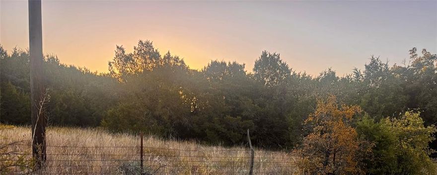 Return to peace and tranquility on this 3.42 acres in Parker County. Abundance of trees and privacy with your own panoramic views of downtown Fort Worth. The property has various elevations with the perfect place to build the home of your dreams, without any known restrictions. The property is located 30 minutes from downtown Fort Worth, 10-15 minutes to Aledo and 20 minutes to shopping in Weatherford TX. Property is located in Azle school district