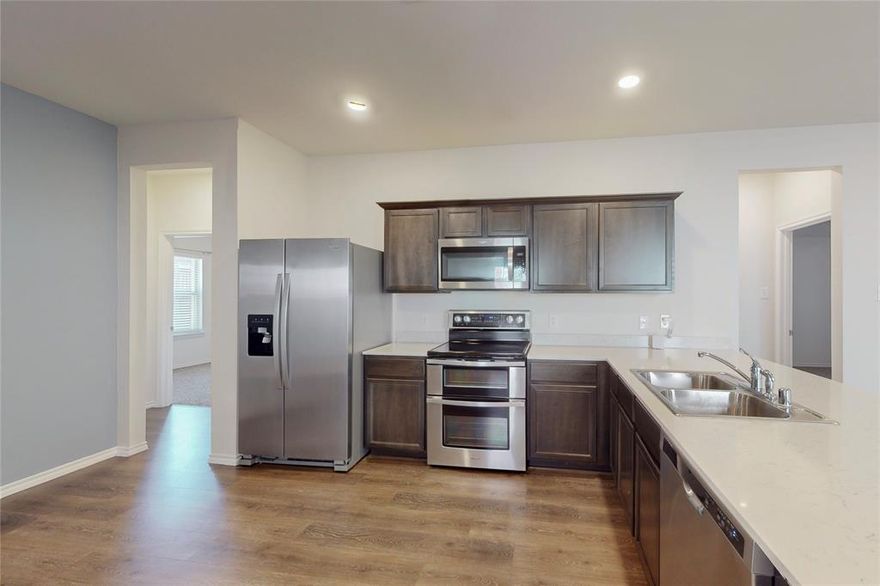 Beautiful new home for lease! This 3 bedroom home has upgraded hard surface flooring, open floor plan design and great backyard! Located in a prime location! Don't miss out on this home! Pets permitted.