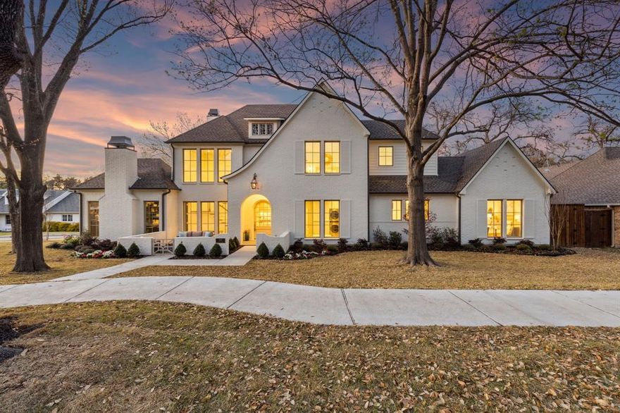 Framed by majestic live oak trees on a sprawling .33 acre corner lot in the heart of Lakewood, this timeless 5 bed, 8 bath new build by Gramercy Custom Homes leaves no detail overlooked. Bathed in natural light, the Italian marble entry makes an incredible first impression. Just off the foyer, a secluded library-lounge is an intimate gathering place or private study with soapstone fireplace and custom millwork. The main living area offers a more generous entertaining space, flowing seamlessly into the sophisticated kitchen with top of the line Sub-Zero and Wolf appliances, prep pantry with a workstation sink and second dishwasher, and hidden walk-in pantry. Adjacent to the kitchen, the entertaining bar is as artistic as it is functional showcasing exotic natural stone framed by custom cabinetry with a built-in ice maker and beverage drawers. Three impressive arched French doors open to an expansive covered outdoor living area overlooking the resort style grounds with sparkling pool-spa, fire bowl seating area, and spacious turf yard for play. First floor primary is a secluded retreat accessed by custom double white oak doors while the primary bath feels like a boutique hotel with honed marble floors, dual white oak vanities, and serene grasscloth wallcoverings. A fully custom closet with built-in laundry center completes the primary wing. Convenient side-entry mudroom with charming dutch door leads to a dedicated pool bath and 2nd staircase for easy access to second floor living with wet bar, half bath, and flex space that can be used for a gym or 2nd office. Also upstairs are four additional beds with marble ensuites serviced by a spacious laundry room. An oversized 3-car garage completes this exceptional home. A short stroll to Lakewood Elementary and 10 minutes to downtown, don’t miss your chance to live in this exquisite custom retreat on one of Lakewood’s most prestigious streets.