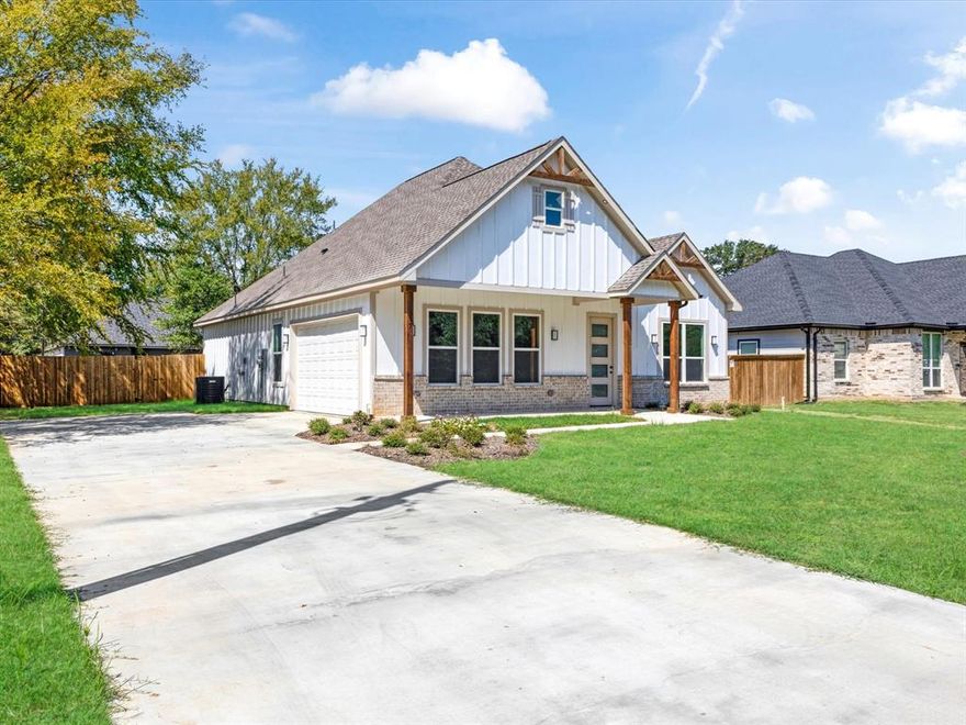 4-bedroom home offers a split, open-concept floor plan with soaring ceilings that create a bright and spacious feel. The kitchen features elegant granite countertops, while the cozy fireplace adds warmth and charm to the living space. Enjoy both a covered front and back porch perfect for relaxing or entertaining. The side-entry garage enhances curb appeal, and the large backyard opens up endless possibilities. Have a boat? You can conveniently park it right in your own backyard. The property is also equipped with a full sprinkler system and exterior lighting that beautifully frames the roofline, giving the home an inviting glow day and night.