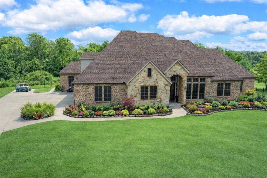 Absolutely stunning custom-built home on a premium cul-de-sac creek lot, designed for luxury living and exceptional entertaining. This impressive layout offers 5 bedrooms and 4 bathrooms, with the media room, 5th bedroom, and 4th bath privately located upstairs, creating the perfect guest retreat.

The main level features 4 spacious bedrooms with 8-ft doors, tiered ceilings, extended crown molding, and oversized walk-in closets, thoughtfully separated for privacy. A grand entry with soaring ceilings and wood floors welcomes you, alongside an elegant office or formal dining space.

The open-concept island kitchen is the heart of the home, featuring stainless steel appliances, pot filler, multiple pantries, large island, and stone façade bar area, all overlooking the Texas-sized living room with corner fireplace, built-in TV cabinetry, surround sound, and wood floors. A rare downstairs game room with dual entry access adds even more space for entertaining.

Step outside to your private backyard oasis featuring a lagoon-style pool with waterfall and firepit, surrounded by wrought iron fencing and ample yard space. The covered outdoor living area includes an outdoor kitchen with built-in BBQ, beverage fridge, granite countertops, TV, and outdoor speakers, plus an additional sun patio with loungers and umbrella stands.

Additional highlights include oversized garage with wood doors, updated zoned HVAC , sprinkler system, custom millwork, hidden safe, abundant storage, extra parking, plantation shutters, and an oversized utility room with space for two sets of washers and dryers.

A truly exceptional home designed for comfort, entertaining, and luxury living. Must see.