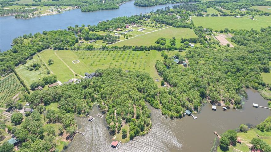 5 Acres of Waterfront Bliss on Lake Fork – Leafy Branch Cove Gem! Escape to the serenity of Leafy Branch Cove with thisrare opportunity to own 5 pristine deeded acres and 1.8 +- acres of leaseback on the picturesque shores of LakeFork—one of Texas’s top trophy bass fishing destinations. This beautiful property features a charming pecan orchard withover 50 mature trees, blending natural beauty with agricultural charm. Enjoy peaceful waterfront views, abundant wildlife,and unbeatable access to world-class fishing right from your own backyard. Essential utilities are already in place, making iteasy to build your dream home, cozy cabin, or investment getaway with minimal hassle. Whether you're looking to relax,retreat, or invest, this slice of Lake Fork paradise is your chance to own a piece of East Texas heaven. Don’t let it get away!