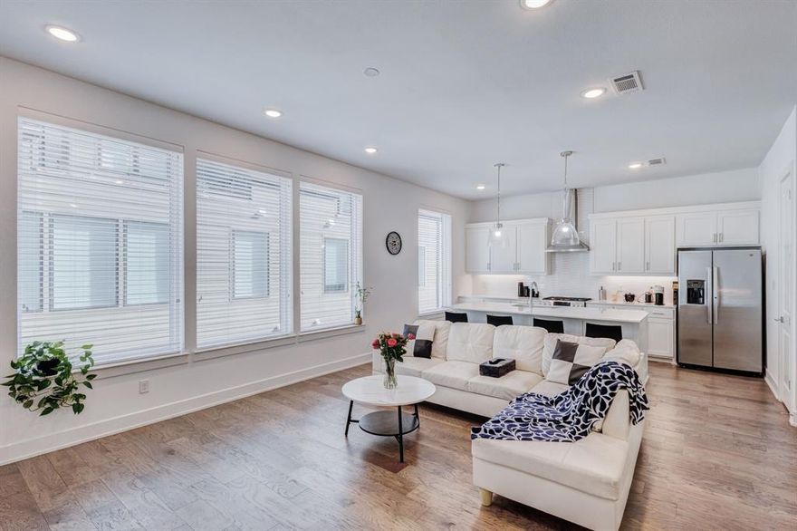 Located in the vibrant Bishop Arts neighborhood, this beautiful 3-story townhome, built in 2022, combines modern style with functional living and a low monthly HOA.  Designed with an open-concept layout, the second floor serves as the heart of the home—featuring a gourmet kitchen with quartz countertops, Bosch appliances, a gas range, and a spacious island with seating, all flowing effortlessly into the living and dining areas. Large windows throughout the home bring in abundant natural light, creating a bright and inviting atmosphere. This level also includes a bedroom and full bath, ideal for guests or flexible living needs. On the first floor, you’ll find a welcoming entry, an additional bedroom with a full bath, and access to the attached 2-car garage—perfect for privacy or a home office setup.The third-floor primary suite offers a peaceful retreat, complete with multiple closets, a well-appointed ensuite bath with dual sinks and a large walk-in shower, and access to a private rooftop terrace—ideal for relaxing mornings or entertaining evenings. Additional features include a fenced front yard perfect for pets, energy-efficient construction, and a prime location near Lake Cliff Park and Kidd Springs Park. Convenient access to , downtown Dallas, major highways, Bishop Arts, Trinity Groves, major hospitals nearby developments makes this home an exceptional find. A fantastic opportunity in a sought-after area—schedule your showing today!