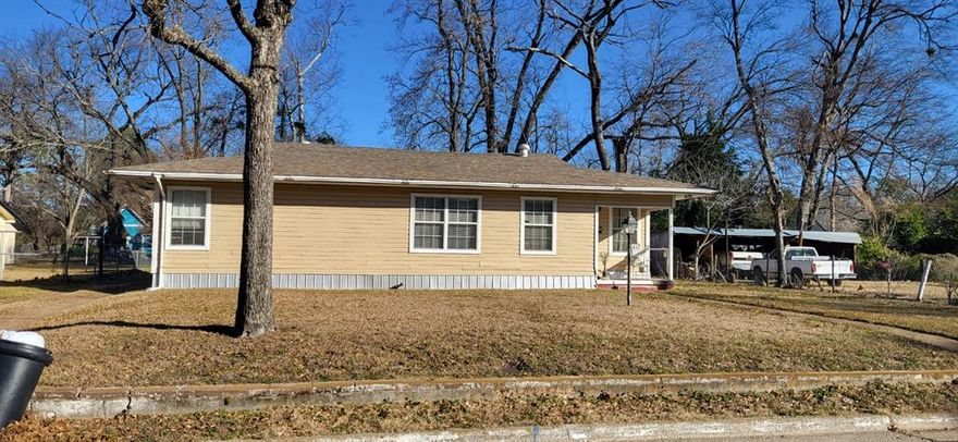 Frame home with 2 car carport, covered area for outdoor cooking plus 3 bedrooms, 1 bathroom HVAC, all electric range and the fridge included. Part of the home has new Pergo flooring plus seller is furnishing additional Pergo for the kitchen, dining room and the bedroom.