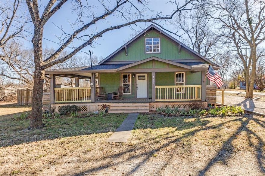 Step into timeless charm in this beautifully maintained 1920s home, where historic character and modern updates come together effortlessly. Original hardwood floors, classic architectural details, and spacious, light-filled rooms reflect the elegance of a bygone era, while thoughtful renovations provide the comfort and functionality today’s buyers appreciate. Enjoy quiet mornings on the inviting front porch or relax and entertain in the beautifully landscaped backyard, complete with a crushed granite patio - perfect for gatherings or peaceful evenings at home. The current owners have lovingly enhanced the property with a full kitchen remodel, the addition of an ensuite bathroom, renovation of the original bath, and the exposure of the original brick fireplace, now fitted with a working pellet stove. Additional improvements include new roof, fresh paint, gravel driveway, tankless water heater, HVAC, addition of a gas line and meter and PEX-A plumbing. Ideally located in a warm, neighborly community, this home offers vintage appeal with modern convenience only 30 minutes from downtown Mckinney and 15 minutes from Sherman.
