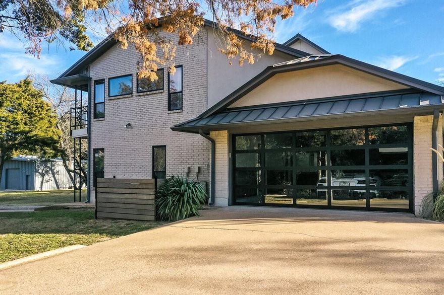 Experience privacy and luxury in this stunning custom home, set on a meticulously maintained 1.5 acre oasis with No HOA! Designed for both relaxation and entertaining, this spacious 6 bedroom, 3 bath home offers the perfect setting for hosting family and friends. Nestled towards the back of the property is a large three bay workshop with full HVAC and electrical providing ample space for boat or RV storage, personal workspace or even a batting cage! This exceptional home is a must see for those seeking luxury, convenience and outdoor adventure all in one!  Enjoy breathtaking views of Joe Pool lake and Cedar Hill State Park from the comfort of your own home. New hiking and bike trails along with multiple ponds for fishing are just steps away! Located right in the heart of DFW you're just a 25 min drive to both downtown Dallas and Ft. Worth.