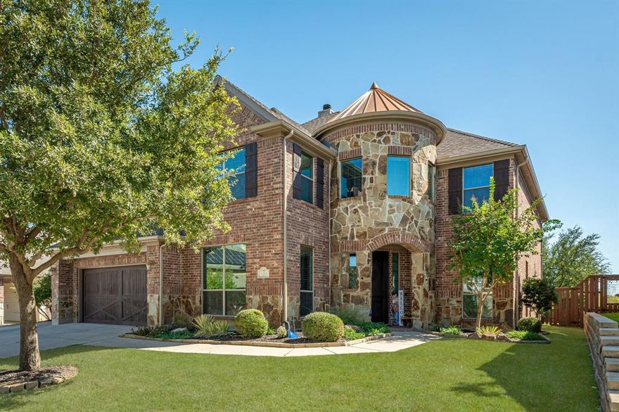 Step into refined elegance nestled within the distinguished Briarwyck community of Roanoke. 1222 Newcastle offers nearly 4,450 sqft of masterfully designed living space, where luxurious materials meet thoughtful architecture. This beautiful home greets you with mature landscaping and purposeful design. Inside, hand-scraped wood floors flow throughout the main level, complemented by plantation shutters and subtle ambient lighting that underscore the home’s bespoke finishes. The heart of the home is the chef worthy kitchen with custom cabinetry, stainless steel appliances, expansive island and breakfast bar where granite countertops deliver both style and function. Retreat upstairs to luxurious privacy. The Guest Suite is a sanctuary of comfort and generous secondary bedrooms each enjoy ensuite baths or premium shared bath access. At every turn are details like an iron baluster staircase, textured walls, and sophisticated hardware, all contributing to the home’s timeless yet contemporary sensibility.Enjoy a lounge worthy media room equipped for immersive surround sound, elevated seating, and dramatic lighting, perfect for stylish entertaining or serene evenings in.Step outside to find an oversized private greenbelt lot ideal for al fresco living, garden dreams, or quiet reflection. The community amenities walking and bike trails, resort style pool, and easy proximity to premier dining and DFW Airport, position this home for both lifestyle and investment. Seller may consider conveying select designer furnishings to create a true move in ready experience. Please ask your agent to inquire about furnishings seller will consider. Schedule your showing today and discover the difference.