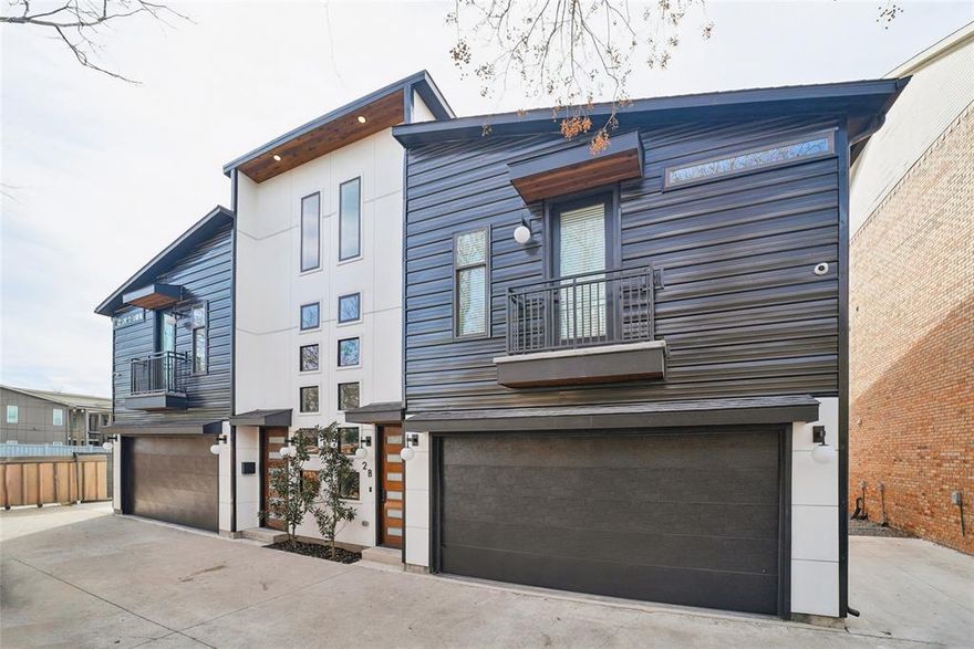 OFFERING $10,000 TOWARDS CLOSING COSTS. Modern new construction condominium in the heart of East Dallas, with 3 bedrooms and 2.5 baths. The striking exterior combines white siding with black metal accents for sleek, contemporary curb appeal.

Inside, double height ceilings and a statement staircase create an impressive entry. The open-concept first floor offers a spacious dining area and a beautifully designed kitchen with stunning black appliances, perfect for everyday living and entertaining.

Upstairs, a flexible loft with built-in cabinetry provides space for a bar, office, or lounge. The spacious primary suite includes a spa-like bath with double vanities, walk-in shower, and walk-in closet, with direct access to the laundry room for added convenience. Two additional bedrooms complete the second level.

Enjoy the backyard and balcony for seamless indoor-outdoor living. Ideally located just minutes from Downtown Dallas with easy access to major highways, restaurants, shopping, and entertainment, offering the perfect blend of modern design and urban convenience.