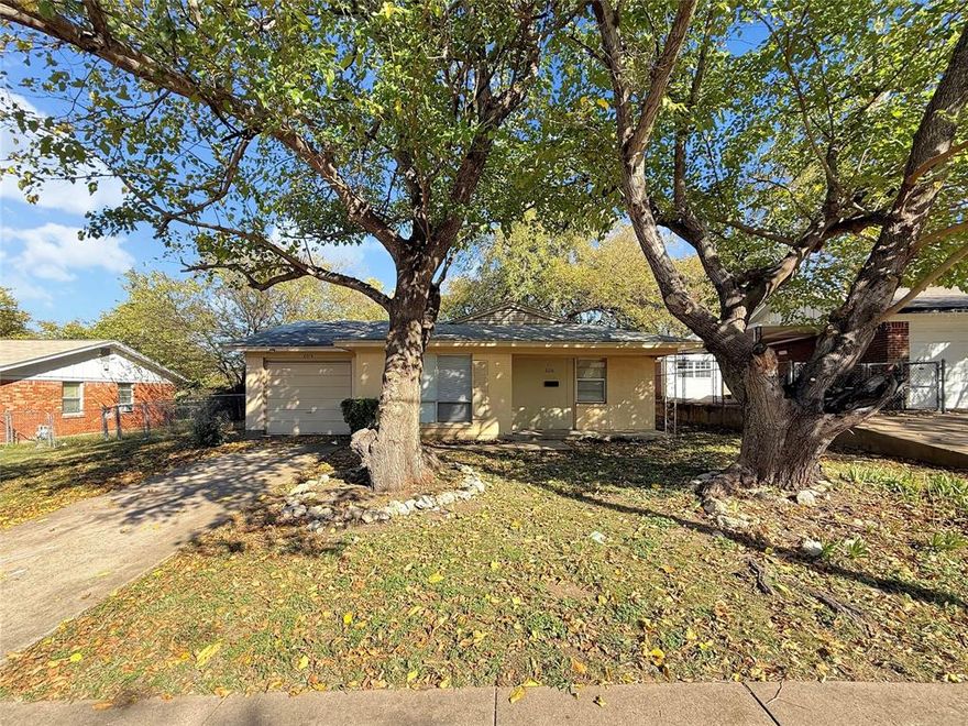 Charming Fort Worth rental tucked away in a quiet neighborhood just off Boat Club Road! This single-story home features a converted garage for added living space, a spacious kitchen with all-electric appliances and a walk-in pantry-storage area, vinyl plank flooring throughout the main living areas, and carpeted bedrooms. Enjoy large shaded trees in both the front and back yards, perfect for outdoor living. Conveniently located near schools, shopping, and dining.
