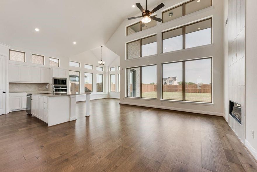 New Grand Home in Park Trails across from Opportunity Central! Spacious Grand South Pointe design. Vaulted family room with 2 story modern fireplace & flat screen tv wire. Lots of wood floors through entry, family room, Home Office, kitchen & dining. Gourmet kitchen has Shaker cabinets, granite slab tops, 5 burner gas cooktop w custom wood vent hood, built in stainless steel appliances, island, trash can drawer & walk in pantry. Full Oak Stairs have modern wrought iron balusters. 8 foot interior doors downstairs, thick moldings, rocker switches & decorative lights. Primary Bath has a free standing tub & rectangle sinks. Covered back patio. Upstairs Gameroom & Large Bonus Room that can be a Media Room or Playroom. Energy Star certified home with R38 insulation, radiant barrier roof, vinyl windows & much more. Neighborhood Pool and winding trails! Walk or Bike to all schools!