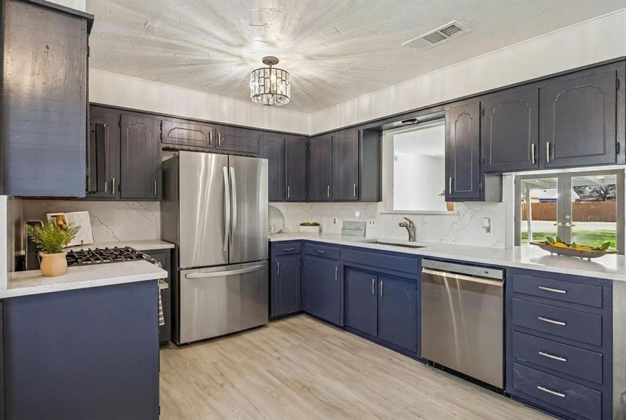 If updated is what you are looking for, LOOK NO FURTHER! Brand new roof put on March 19, 2026. Adorable ranch home on over .25 acre lot, with a 2 car garage AND a circle driveway for plenty of parking. Tons of updates, cosmetic and mechanical, make this an amazing Crowley home, ready for new owners to walk right into! This summer will be a breeze with the new HVAC system. Enjoy cooking in your updated kitchen with brand new stainless appliances, stainless sink and faucet, and stunning white quartz counters and backsplash. The new vinyl plank flooring spans the main areas and complements the home beautifully. Brand new carpet has been installed in the 3 bedrooms. The full interior and exterior have been repainted in todays trendy colors. All new efficient double pane windows throughout will help keep your home warm in winter and cool in the summer. The rooms are bright with the updated lighting and ceiling fans in the primary and family room. In the master bath, the master shower has been updated with a brand new glass shower door. Even the garage sparkles with the new epoxy floor, and the re-taped and painted sheetrock, making this a garage you will want to hang out in. Added bonus, a third garage door on the back side of the garage that leads to the backyard! This makes it easy to pull a car or bike or boat through, to easily store in backyard and out of sight! Out back, enjoy a HUGE yard and covered patio and deck. Homes in this neighborhood don't come up very often and are popular for their large lot size. Don't miss this opportunity at this price point and great location. NO HOA, Convenient to 35W. Other updates include a new electrical panel. Make this home yours before it is gone!