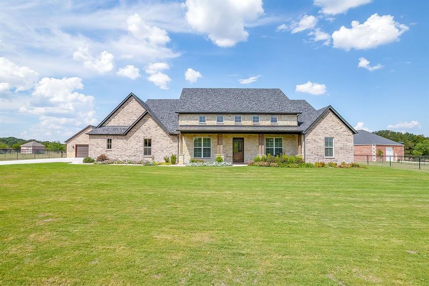 Welcome to 420 Cattlebaron Parc Estates, where luxury ranch living meets timeless Texas charm. This modern Hill Country inspired residence offers 3,343 square feet with 5 bedrooms, an office, 3 full bathrooms, and a 3 car garage, all thoughtfully designed for comfort, function, and style. Tucked inside the secluded and privately gated Cattlebaron Parc Estates, the home sits at the end of a gated, extended driveway and greets you with a large front porch. Step inside to an open concept kitchen and living area highlighted by soaring cathedral ceilings, hardwood flooring, and a floor to ceiling stone fireplace. The kitchen is a chef’s dream with an expansive layout, quartz countertops, and a huge walk in pantry, perfectly blending beauty and function. Outdoors, a spacious covered back patio with a wood burning fireplace extends your living space, creating the perfect setting for year round relaxation and entertaining. In addition to the attached 3 car garage, a detached 2 car garage provides extra storage or the ideal space for a workshop. The property's fully fenced and cross fenced with pipe no climb fencing, along with additional gates, allowing you to easily bring horses or a few head of cattle. Cattlebaron Parc Estates offers an unmatched lifestyle with exclusive community amenities including a clubhouse, pool, park, and riding trails. Located within the acclaimed Silver Creek Elementary zoning and just a short, convenient commute to Fort Worth, this home delivers the rare combination of comfort, wide open space, and accessibility.