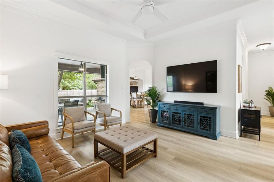 One of the biggest reasons buyers are drawn to Heath is access to highly regarded Rockwall ISD-a district known for strong academics, competitive athletics, and exceptional fine arts programs. Beyond the ratings, it’s the sense of community and well-rounded student experience that makes this area especially appealing for long-term homeowners.

Life in Heath offers something many buyers are searching for but rarely find: space, quiet, and proximity to the lake-without sacrificing access to the city. Situated just minutes from Lake Ray Hubbard and the waterfront restaurants and entertainment at The Harbor in Rockwall, this home places you right in the heart of one of the area’s most desirable lakeside communities.

With easy access to Interstate 30 and Highway 66, commuting into Dallas is simple while still enjoying the slower pace and lifestyle that makes Heath so special.

Inside, the home welcomes you with bright, open living spaces and soaring ceilings. Two separate living areas provide flexibility for gathering, relaxing, or creating a dedicated workspace or playroom. The updated kitchen with crisp white cabinetry and sleek countertops sits at the center of it all—perfect for everything from quick mornings to hosting friends and family.

Step outside and you’ll discover one of the home’s most valuable features: the oversized lot. At nearly .28 acres, the backyard offers significantly more outdoor space than many newer homes in the area. Mature trees provide shade while the covered patio creates a natural extension of the home-ideal for evening dinners, weekend gatherings, or simply enjoying quiet sunset views. A brand-new fence and drip irrigation system make the space both private and easy to maintain.

Homes offering this much outdoor space, lake proximity, and access to Rockwall ISD’s sought-after schools at this price are increasingly hard to find-making this one worth seeing.