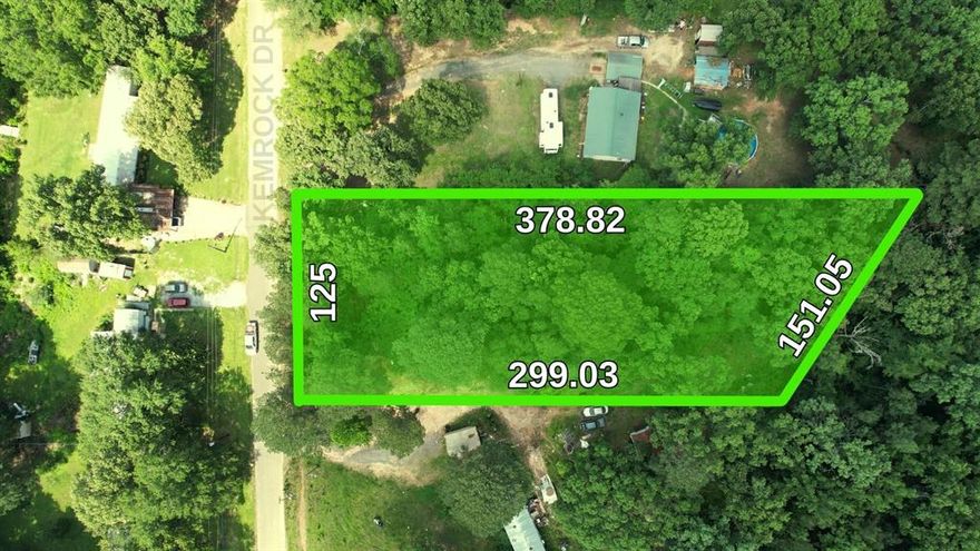 Owner financing is available for this nearly 1-acre wooded lot located just 5 minutes from the Caddo Boat Launch in a calm, established neighborhood. The property has an existing driveway and a leveled area ideal for mobile or manufactured homes. Essential utilities like electric, gas, and water are available at the street (septic will need to be installed), and the property is not in a flood zone. For families, the location is conveniently on a school bus route serving all grade levels and is just 13 minutes from Walmart and 25 minutes from downtown Shreveport. Vacant land:  Showings 24-7. Please schedule through Broker Bay for auto confirm.