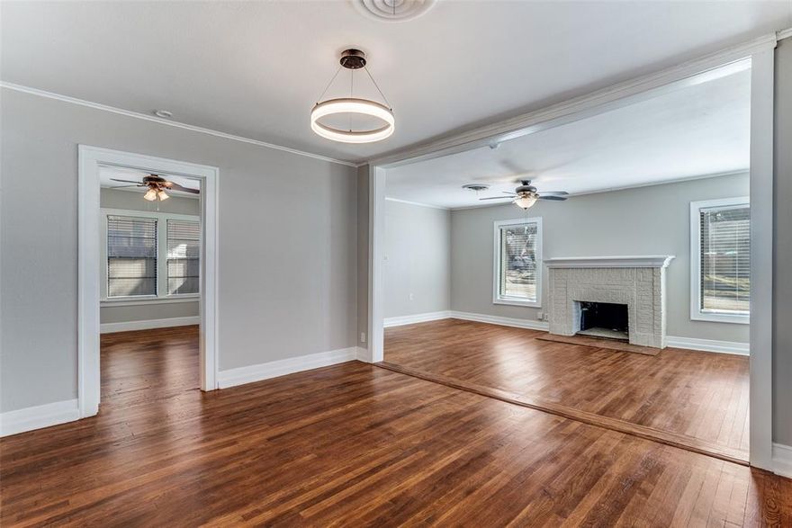 Absolutely Charming Tudor Cottage that is full of character, light, and major system upgrades. Original hardwood floors have been beautifully refinished throughout, highlighting the home’s warmth and timeless appeal. Natural light pours into the spacious living area, anchored by a classic fireplace and oversized windows.

The kitchen features granite countertops, updated hardware, and abundant cabinet storage, blending vintage charm with everyday functionality.

Recent improvements provide true peace of mind: ALL new plumbing from the street through the entire home, roof replaced in 2023, recent HVAC servicing, new gutters, new fence, fresh interior and exterior paint, and new pillars on the covered back patio.
Step outside to a fully fenced backyard with an oversized covered patio — ideal for entertaining, morning coffee, or relaxed evenings. The welcoming front porch and distinctive curb appeal make this home stand out from the moment you arrive. Large storage shed adds extra flexibility.

Oozing with Character - check. Updates - check. Move-in ready - check.