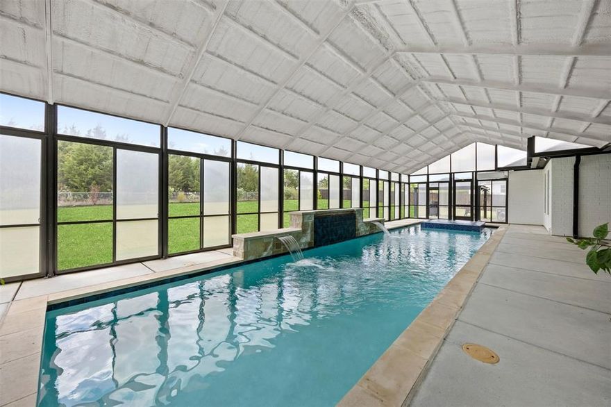 NEW PRICE IMRPOVEMENT!!! SUTNNING HOME WITH NO HOA and an ENCLOSED POOL, THIS IS ONE Stunning Elmwood Custom Home on a 1.033 acre lot. This single-story residence features 4 bedrooms, 3 full bathrooms, and multiple living spaces including a spacious game room, formal dining area, and inviting main living room with an oversized gas fireplace. The kitchen is truly amazing with a soaring waterfall island spanning 21 feet! Complete with double ovens, double dishwashers, double microwaves, a luxury built in fridge and a premium 5-burner range with built-in grill. This kitchen is absolutely a game changer for all of your entertainment needs. One of the most impressive features of this property is the indoor, covered pool—fully heated and enhanced with a waterfall feature and hot tub. The pool area is complete with added insolation allowing for year-round enjoyment no matter the season. Additional highlights include a 3-car garage with oversized garage doors, a wood privacy fence, and a roof that is only one year old with a metal roof covering the indoor pool.  The fourth bedroom currently does not have a closet as it's used as a study, but can easily be modified to suit your needs. If you’ve been searching for a unique property that combines indoor luxury with outdoor space and functionality, this home delivers on every level.