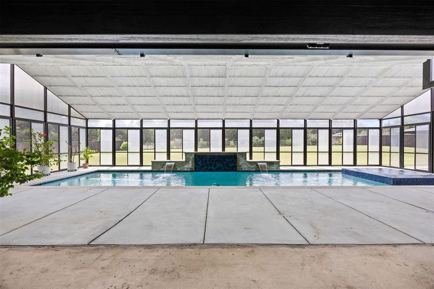 NO HOA and an ENCLOSED POOL, THIS IS ONE Stunning Elmwood Custom Home on a 1.033 acre lot. This single-story residence features 4 bedrooms, 3 full bathrooms, and multiple living spaces including a spacious game room, formal dining area, and inviting main living room with an oversized gas fireplace. The kitchen is truly amazing with a soaring waterfall island spanning 21 feet! Complete with double ovens, double dishwashers, double microwaves, a luxury built in fridge and a premium 5-burner range with built-in grill. This kitchen is absolutely a game changer for all of your entertainment needs. One of the most impressive features of this property is the indoor, covered pool—fully heated and enhanced with a waterfall feature and hot tub. The pool area is complete with added insolation allowing for year-round enjoyment no matter the season. Additional highlights include a 3-car garage with oversized garage doors, a wood privacy fence, and a roof that is only one year old with a metal roof covering the indoor pool.  The fourth bedroom currently does not have a closet as it's used as a study, but can easily be modified to suit your needs. If you’ve been searching for a unique property that combines indoor luxury with outdoor space and functionality, this home delivers on every level.