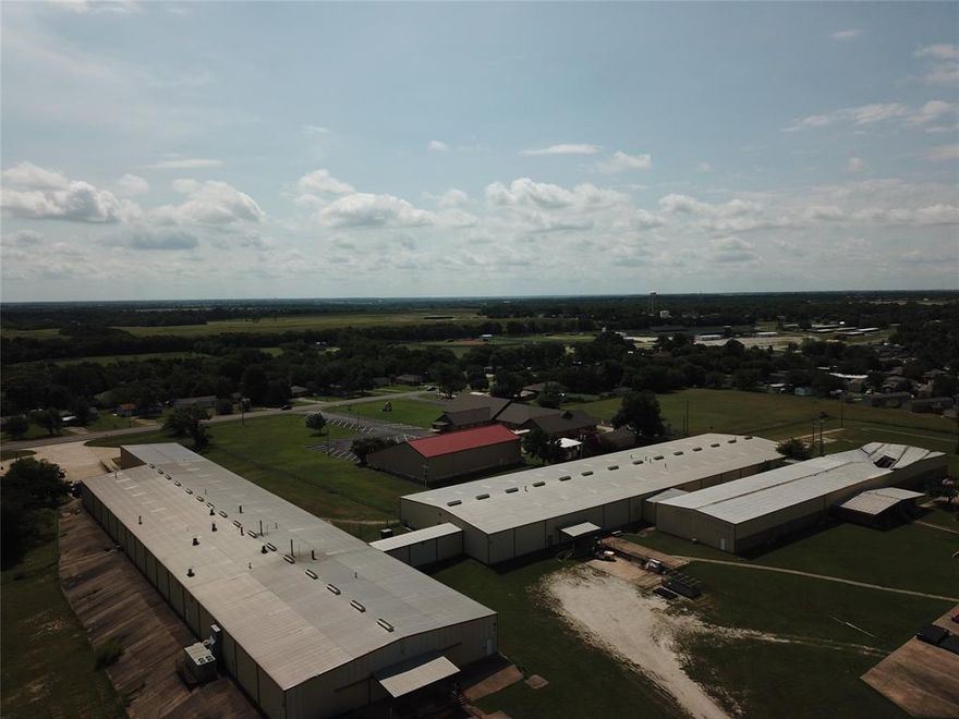 Building  is 95,000 sf of which 40,000 sf is Midwest Powder Coat designed and built line - 1000 ft powder coat line  consisting of 5 stage washer, large environmental room, recent environmental room, large air unit purchase, burn off oven and all hooks and racks. The remaining portion of building is fabrication and office space. 
The building has access off Hwy 75 and Hwy 5, 2 docks off Hwy 75, and 2docks off Hwy 5, in addition there is 1 overhead drive in door off Hwy 5. 
Building has City of Howe utilities, 480 electrical service and ample paved parking. Property has fenced outside storage with plenty of room to accommodate additional IOS if need. The building is designed so the powder coating operations could be purchased independently from office and fabrication activities.
The property has aprox 1160 ft of frontage on Hwy 75 and aprox 208 frontage on Hwy 5, all situated one exit south of the TI complex, aprox 1.25 
miles. Owner will consider financing with  acceptable downpayment and terms.

PROPERTY AND BUILDING CAN BE SUBDIVIDED: Powder Coat Line, approximately 40,000 sf bldg, and all contents, 2 docks on HWY 75, 2 docks and Overhead drive in Door on HWY 5  $6,985,000 including approximately 3 acres of land. NORTH SIDE OF SURVEY.

Fabricating and office, approximately 50,000 sf facility, access to HWY 75, 2 docks on HWY 75 side and 2 docks on south side of bldg, 480 electrical service, water, sewer and restrooms, Coity of Howe.     $6,870,000  CENTER OF SURVEY