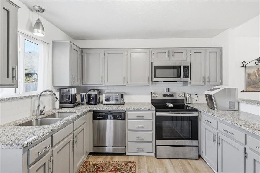 Rare opportunity to own a beautifully remodeled half duplex in the heart of Keller, zoned for highly sought-after Keller ISD and Keller High School. This charming 2-bedroom, 2-bath home offers a desirable open-concept, split-bedroom floor plan enhanced by vaulted ceilings in the living area and both bedrooms, creating a light and spacious feel. Luxury vinyl plank flooring flows seamlessly throughout all living spaces and bedrooms. The updated kitchen features granite countertops, painted cabinetry, and stainless steel appliances. Both bathrooms have been tastefully updated with beautiful vanities, designer tile surrounds, decorative mirrors, and modern lighting. There is lots of closet space too! In the back courtyard, there is a storage shed and a storage closet with a cute patio and a garden area. Ideally located with quick access to Keller Town Square and Southlake Town Square for shopping, dining, and entertainment. Don’t miss this move-in-ready home in an exceptional location.